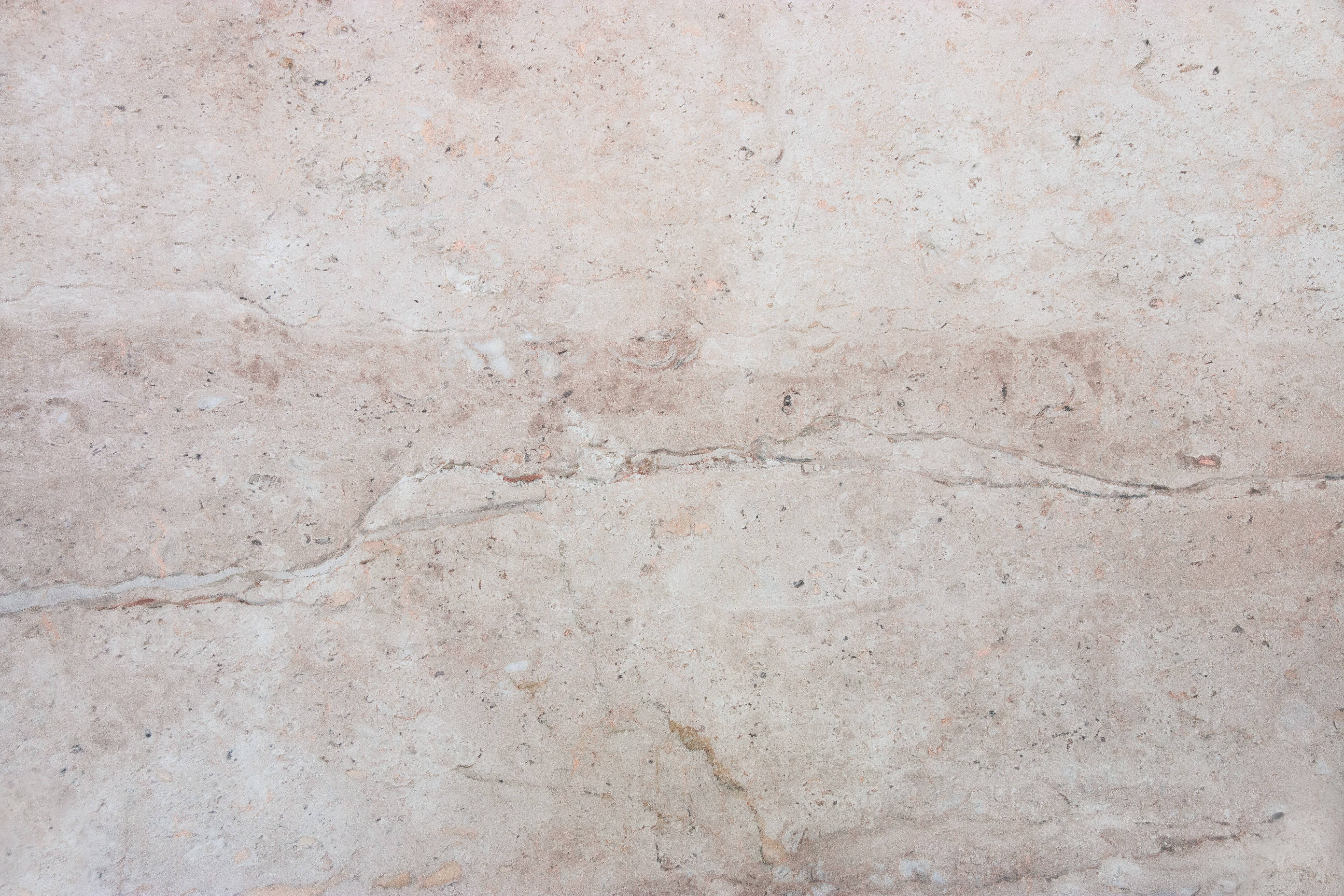 Caption: Enchanting Cream Stone Texture Marble in 4K Resolution Wallpaper