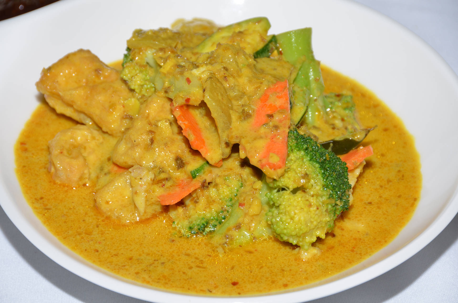 Creamy And Tasty Yellow Curry Dish In Bowl Wallpaper