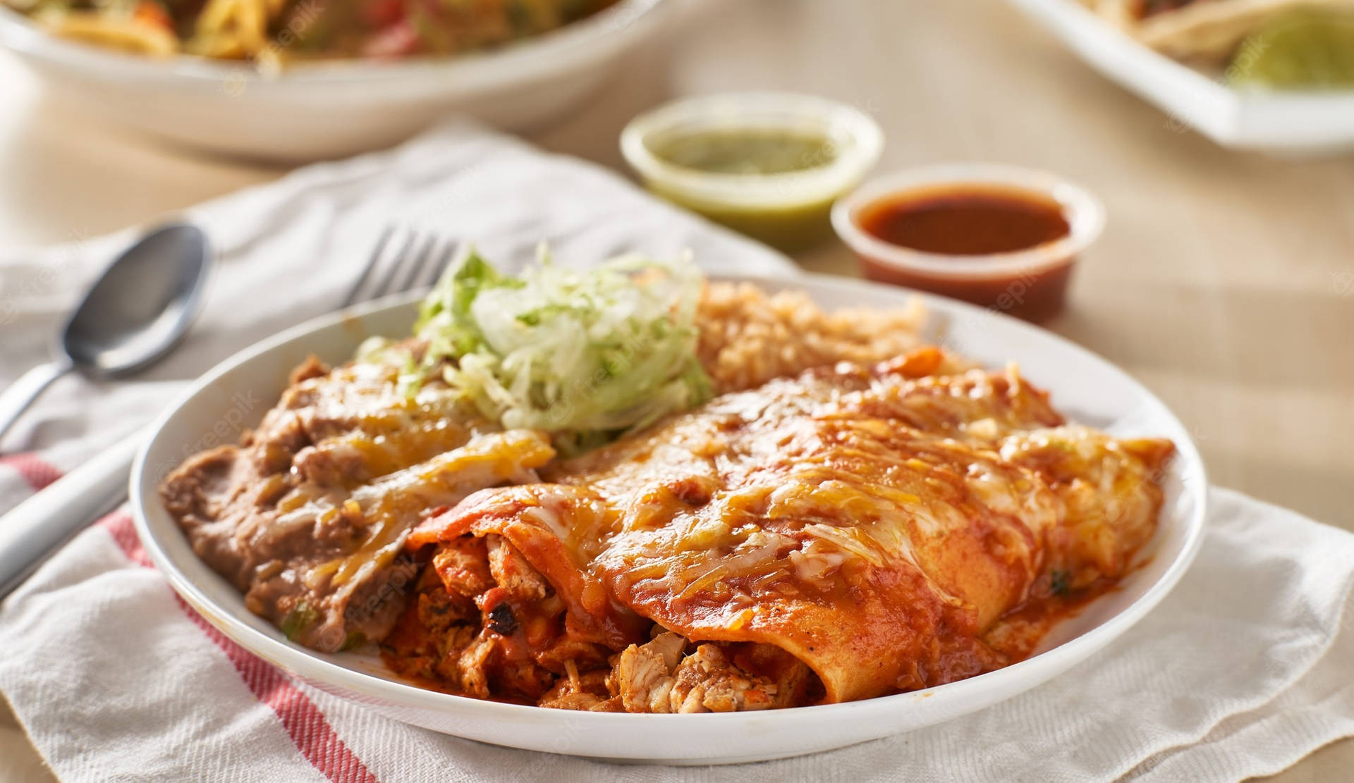 Mouthwatering Creamy Enchiladas Plated to Perfection Wallpaper