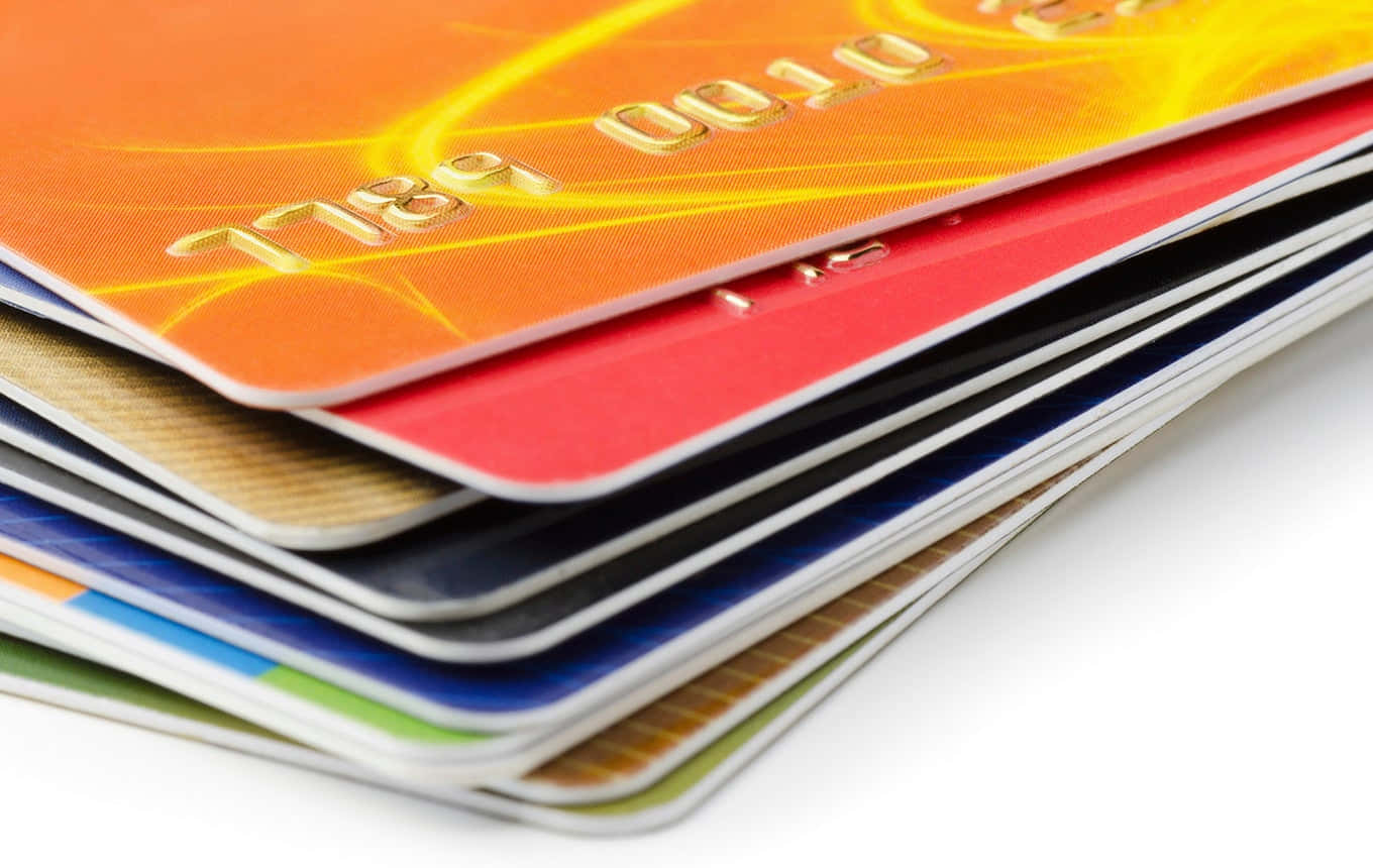 A Pile Of Credit Cards On A White Background