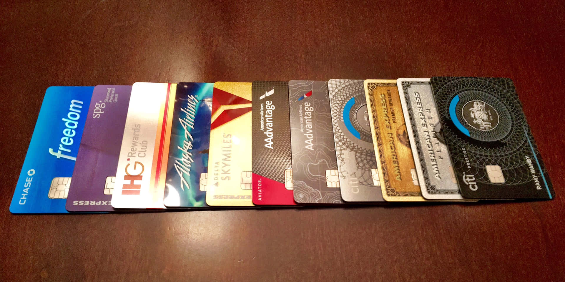 A Group Of Credit Cards Arranged On A Table
