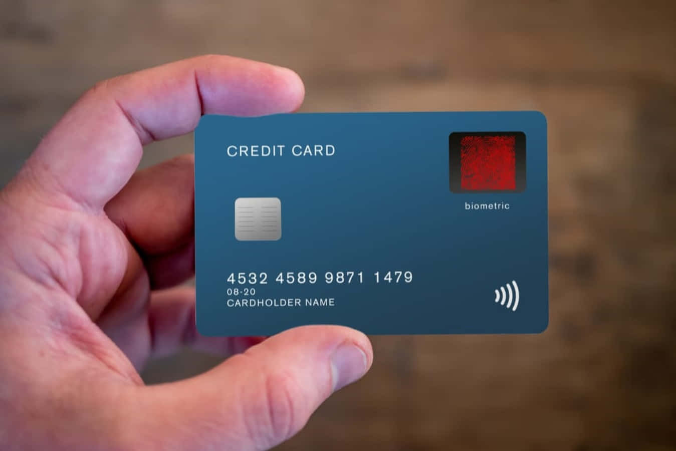 A Person Holding A Credit Card With A Red And Blue Stripe