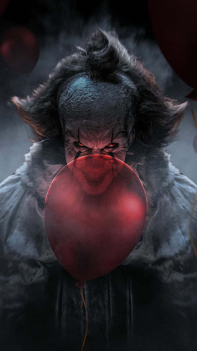 Creepy_ Clown_with_ Red_ Balloon Wallpaper