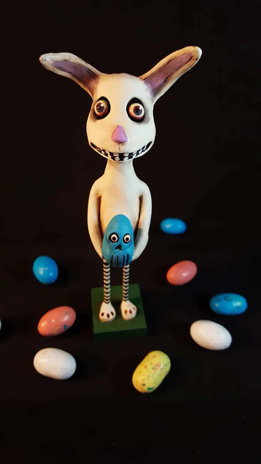 A Bunny Figurine With Candy In His Hands