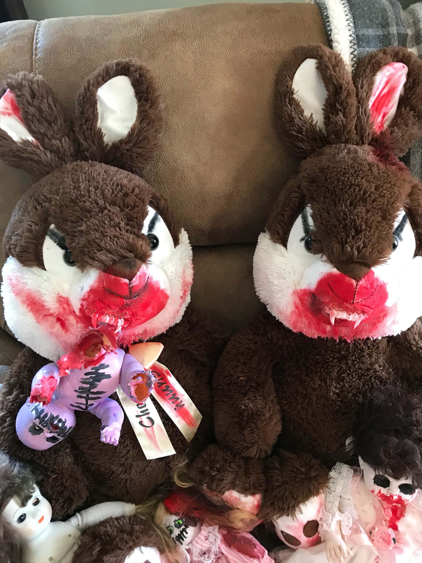 Two Stuffed Animals With Blood On Their Faces