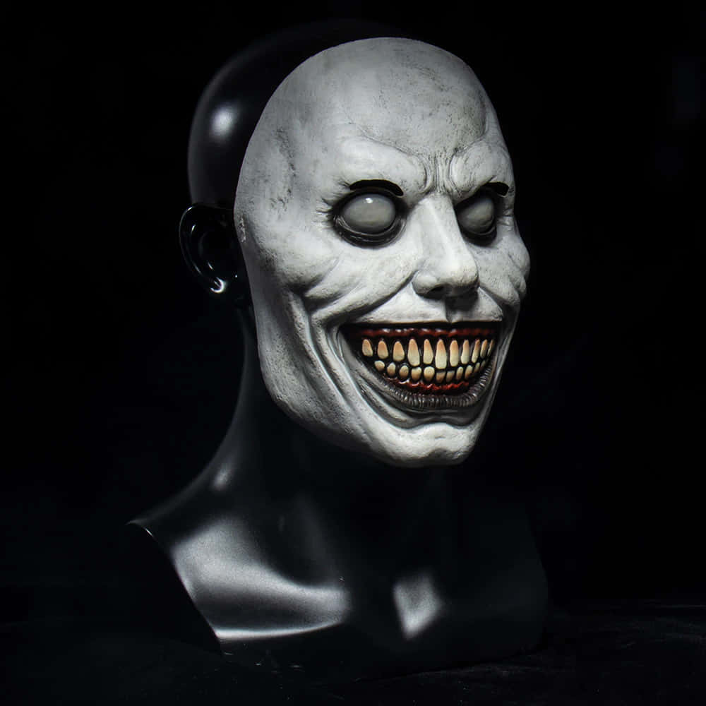 A White Mask With A Large Mouth And Teeth
