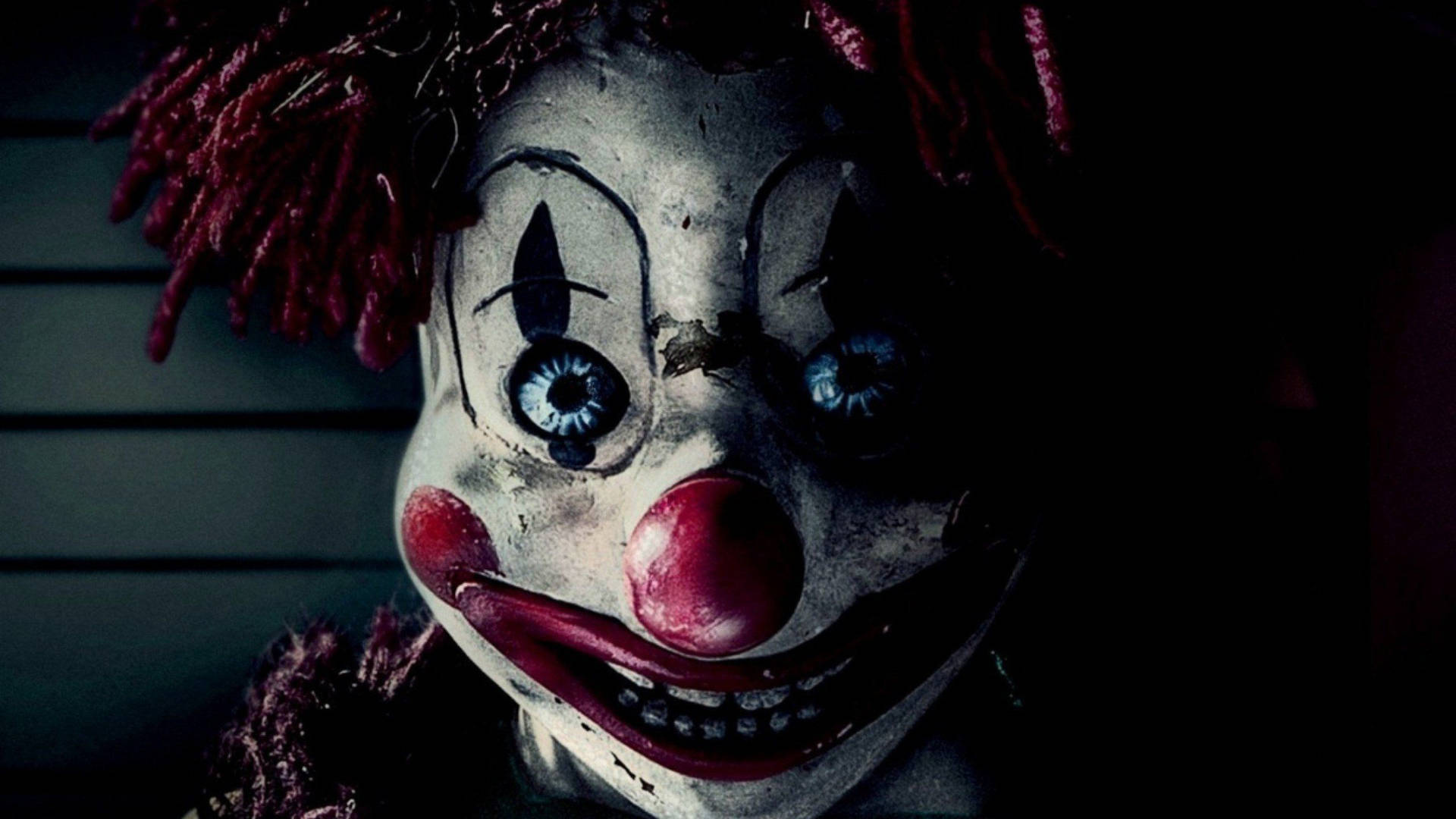 Beware of the creepily smiling clown Wallpaper