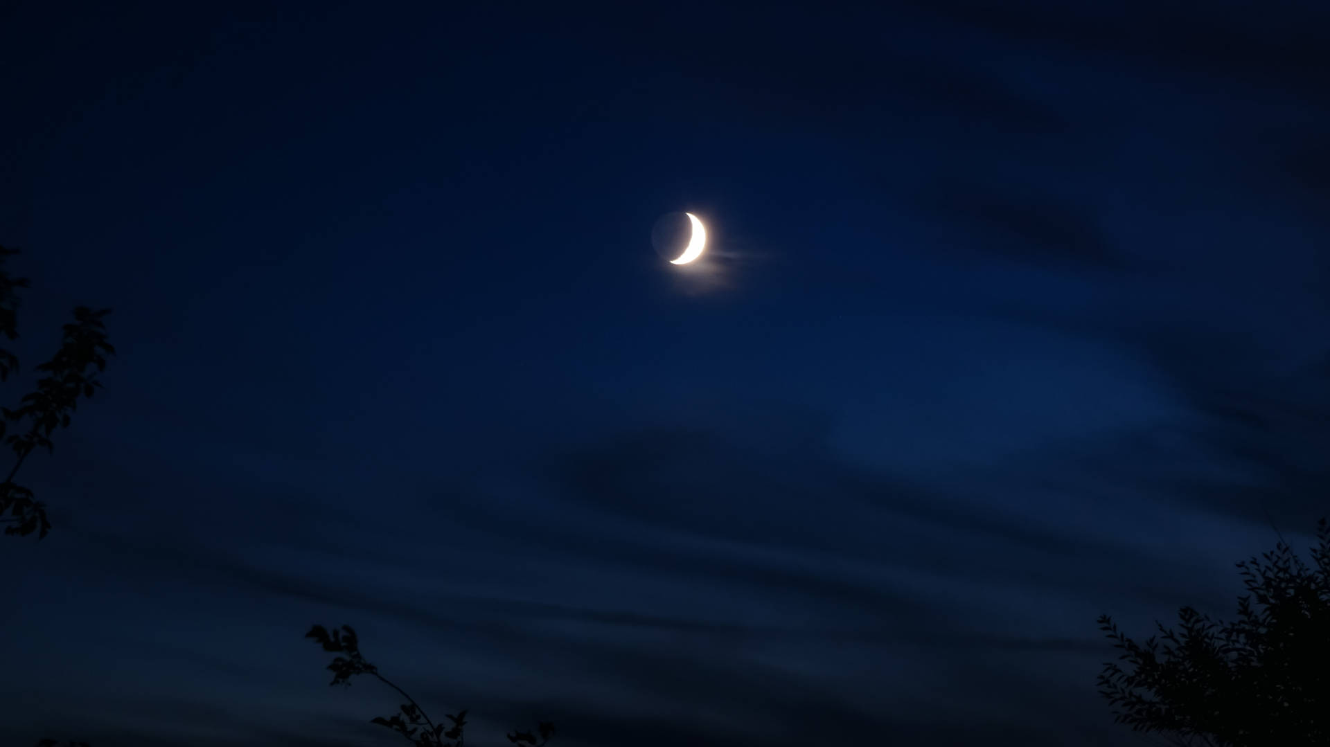 Crescent Moon In Navy Blue Sky Background