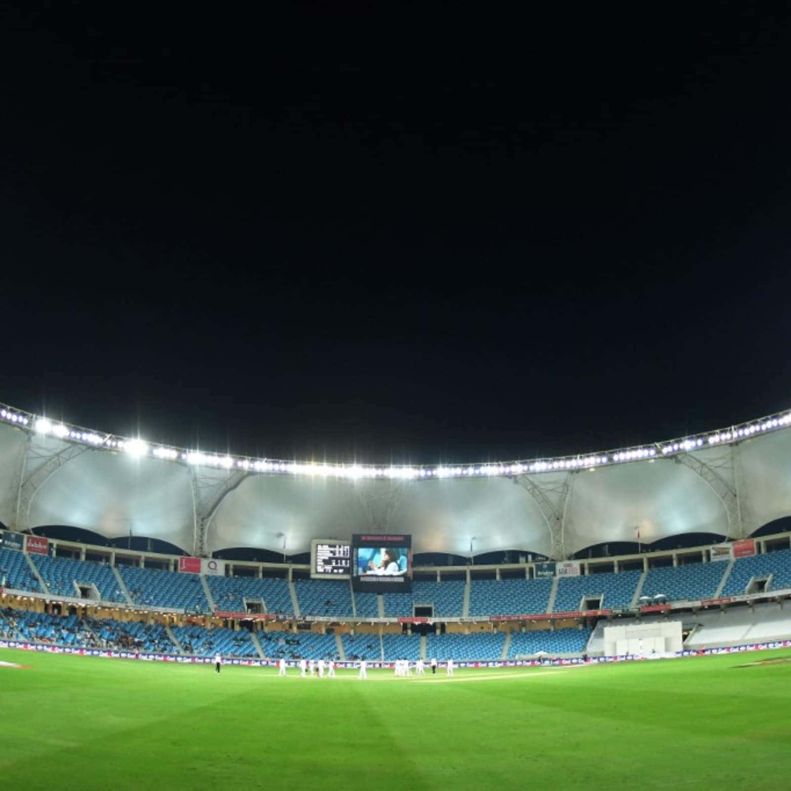 A Stadium With Lights On At Night