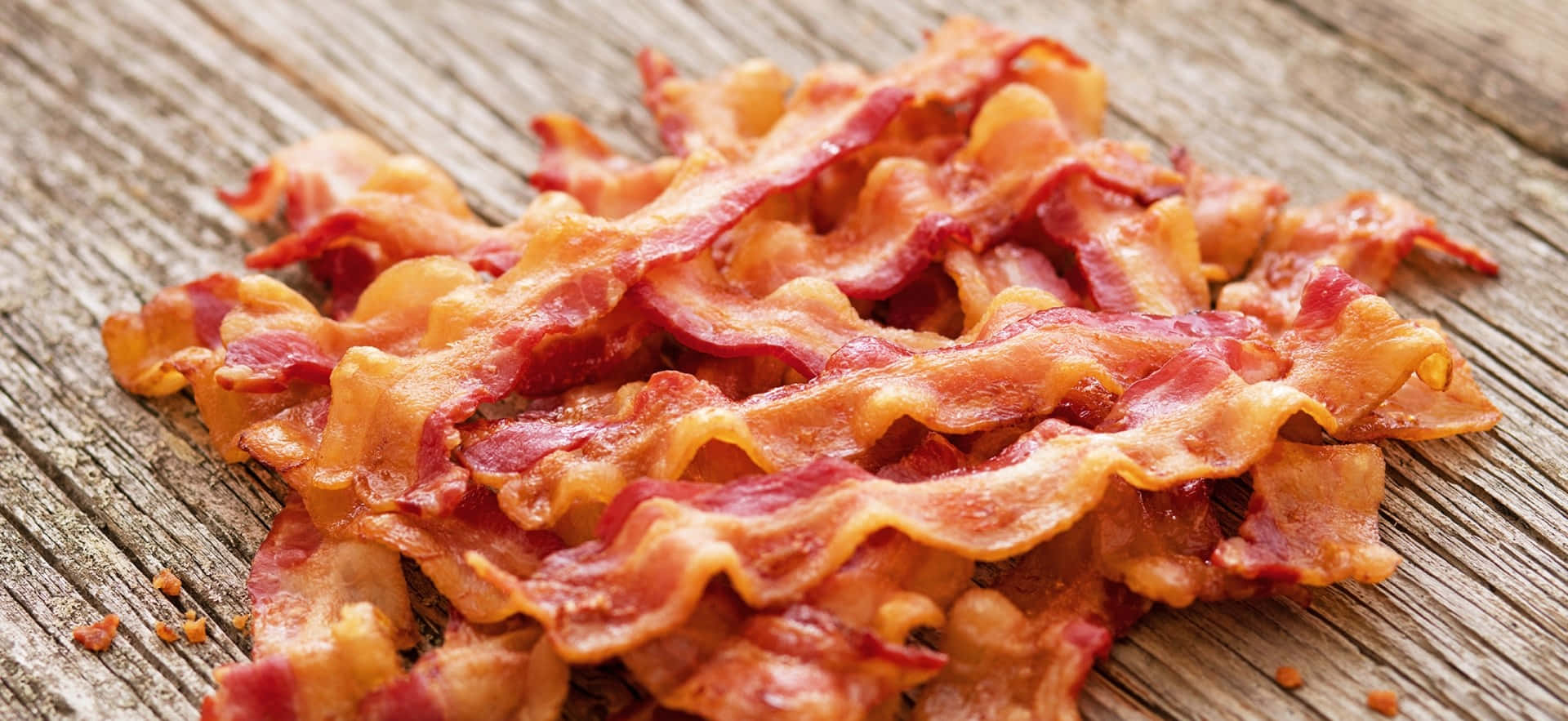 Download Crispy Bacon Stripson Wooden Background Wallpaper | Wallpapers.com