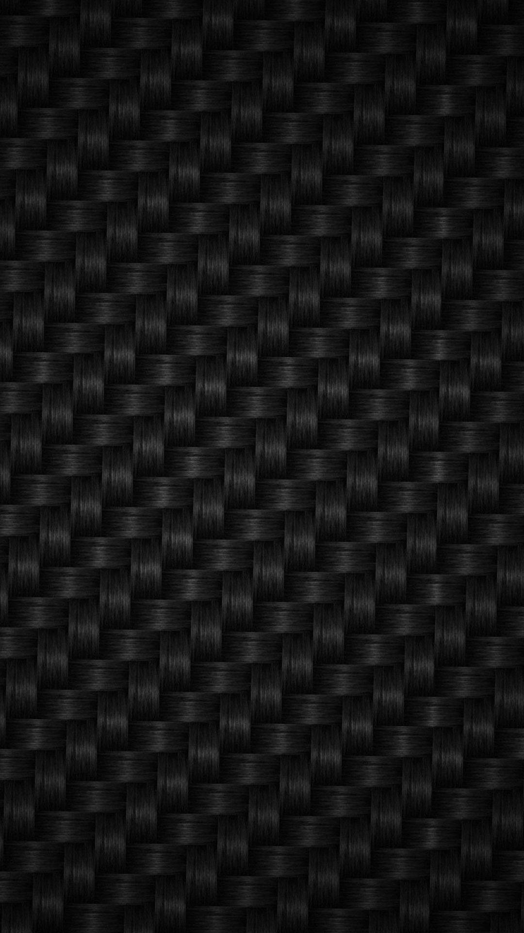 A close-up of criss-crossed carbon fiber Wallpaper