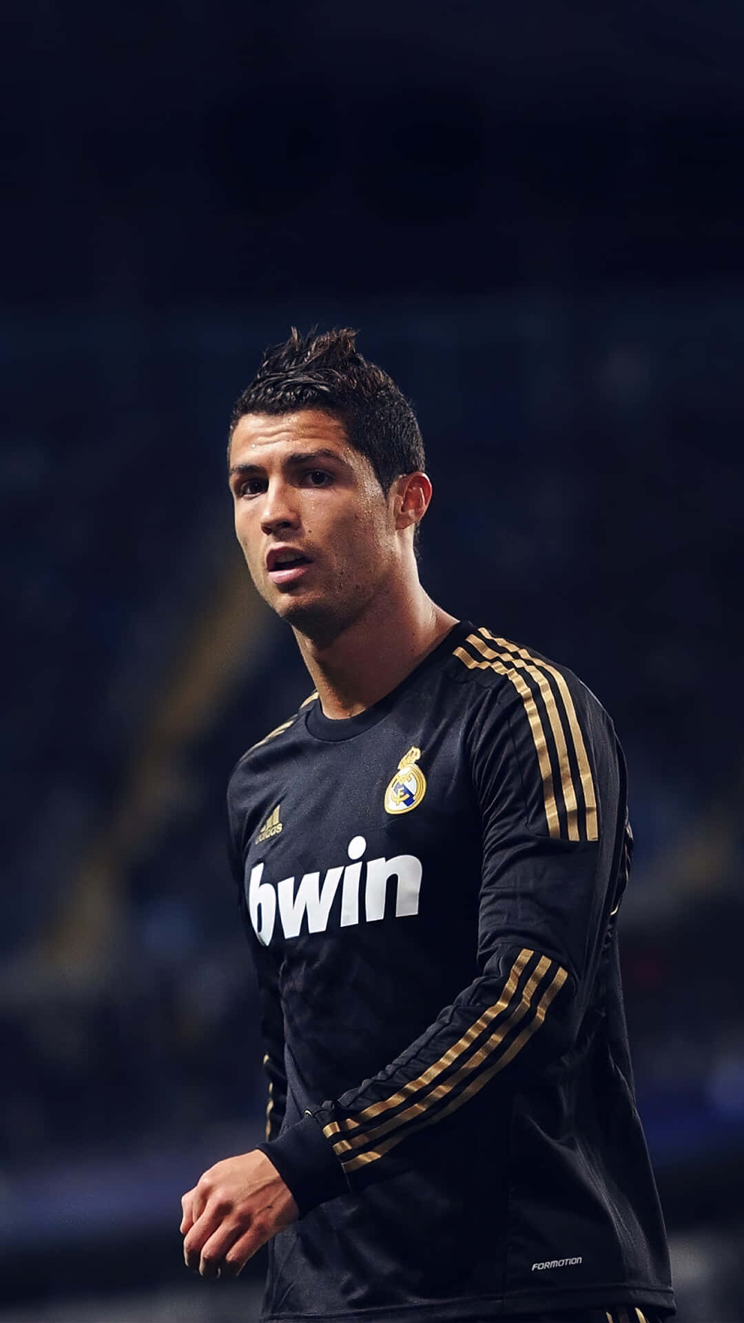 Cristiano Ronaldo kicking the ball with intense concentration Wallpaper