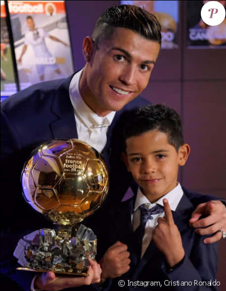 Cristiano Ronaldowith Golden Balland Child PNG