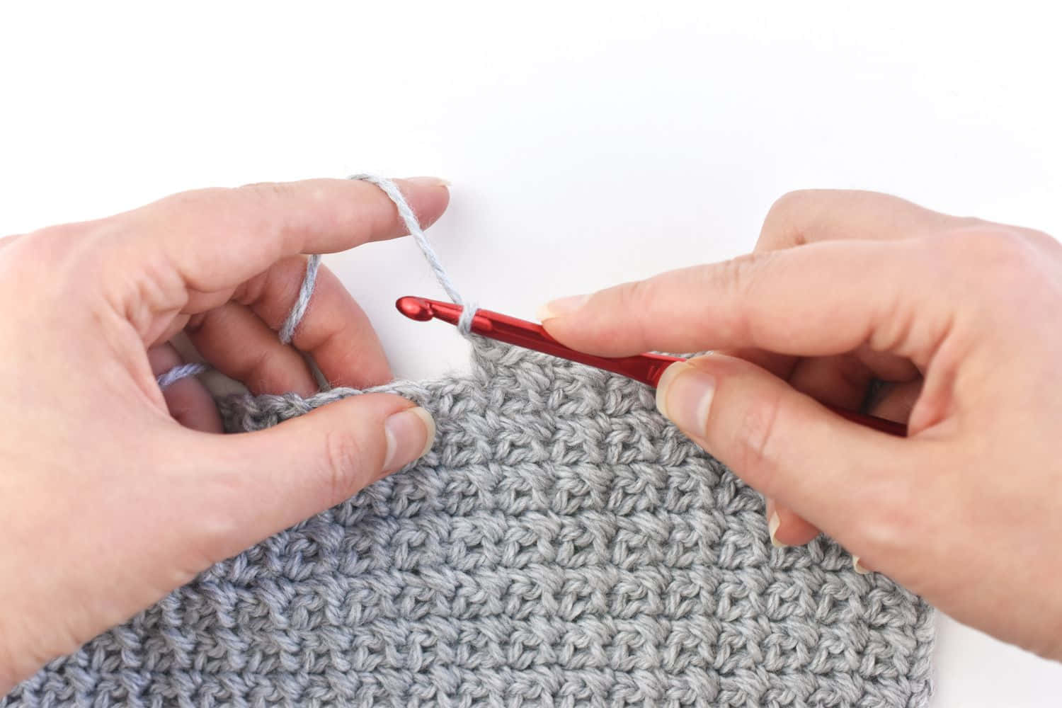A Person Is Holding A Crochet Hook And A Crochet Stitch