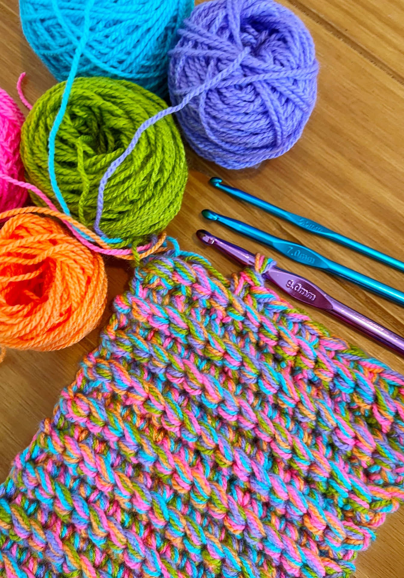 Download A Colorful Crocheted Bag With Yarn And Knitting Needles ...