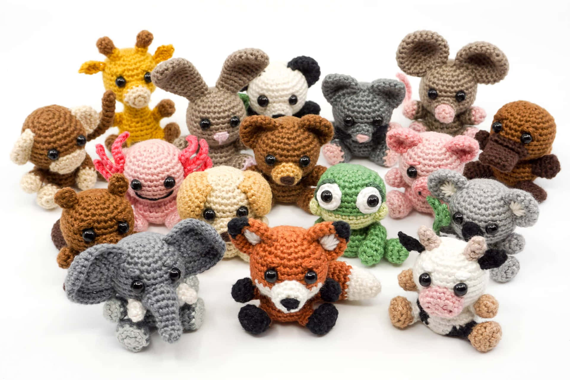 A Group Of Crocheted Animals Arranged In A Circle