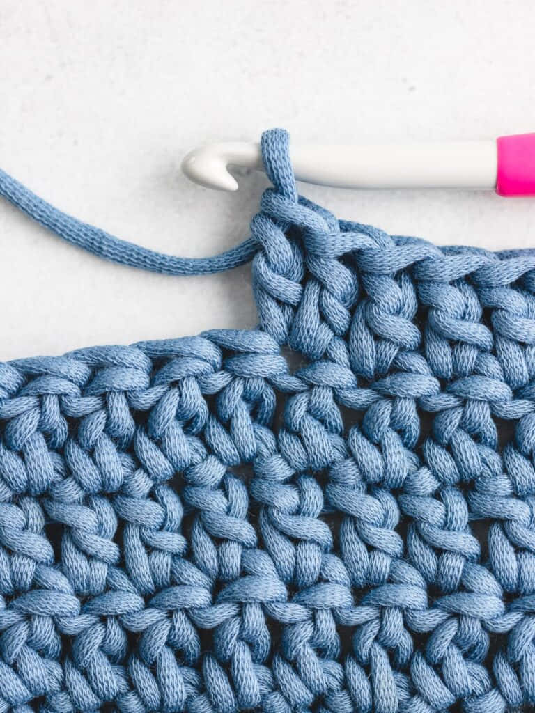 Crocheting A Blue Crochet Stitch With A Pink Crochet Hook