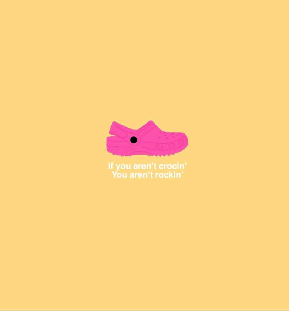 A Pink Shoe With The Words If You're Not Crocs You Won't Be Crocs