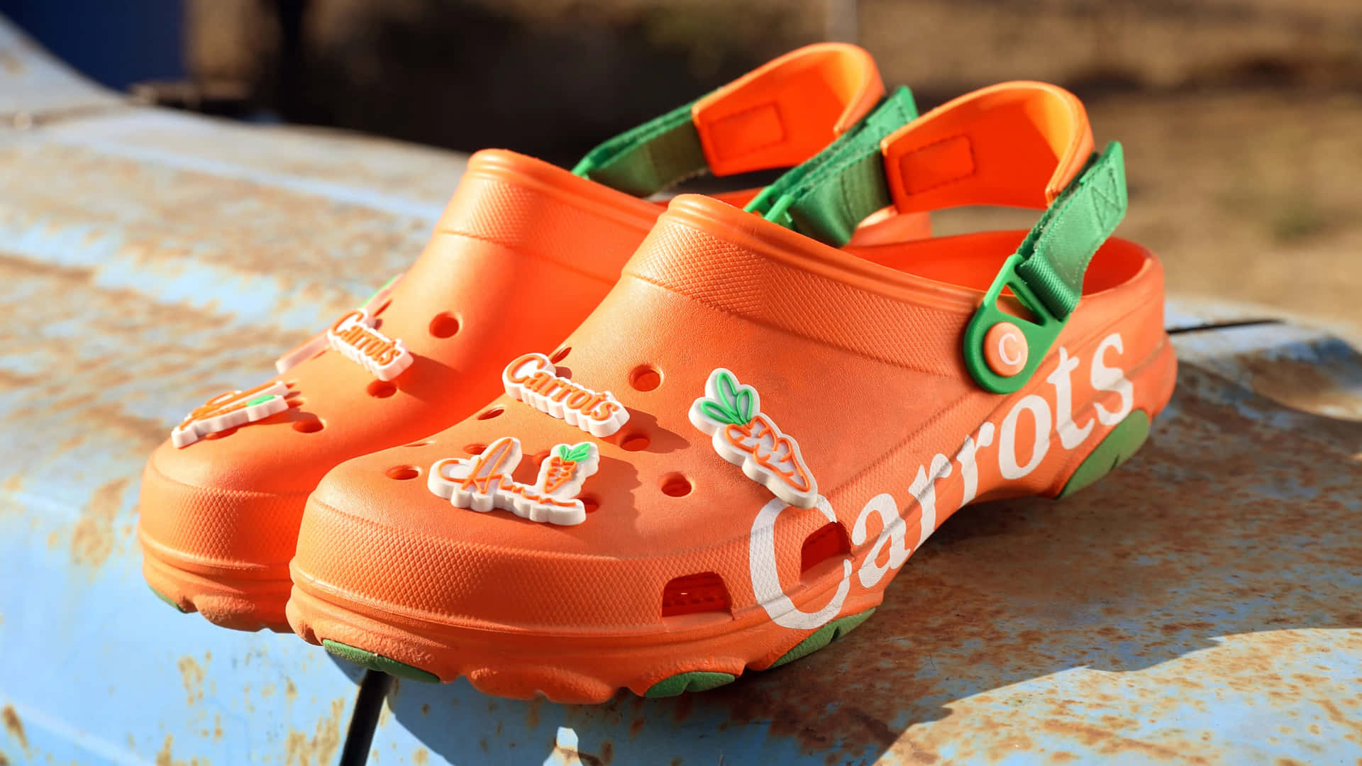 A Pair Of Orange Clogs With The Words Carrots On Them