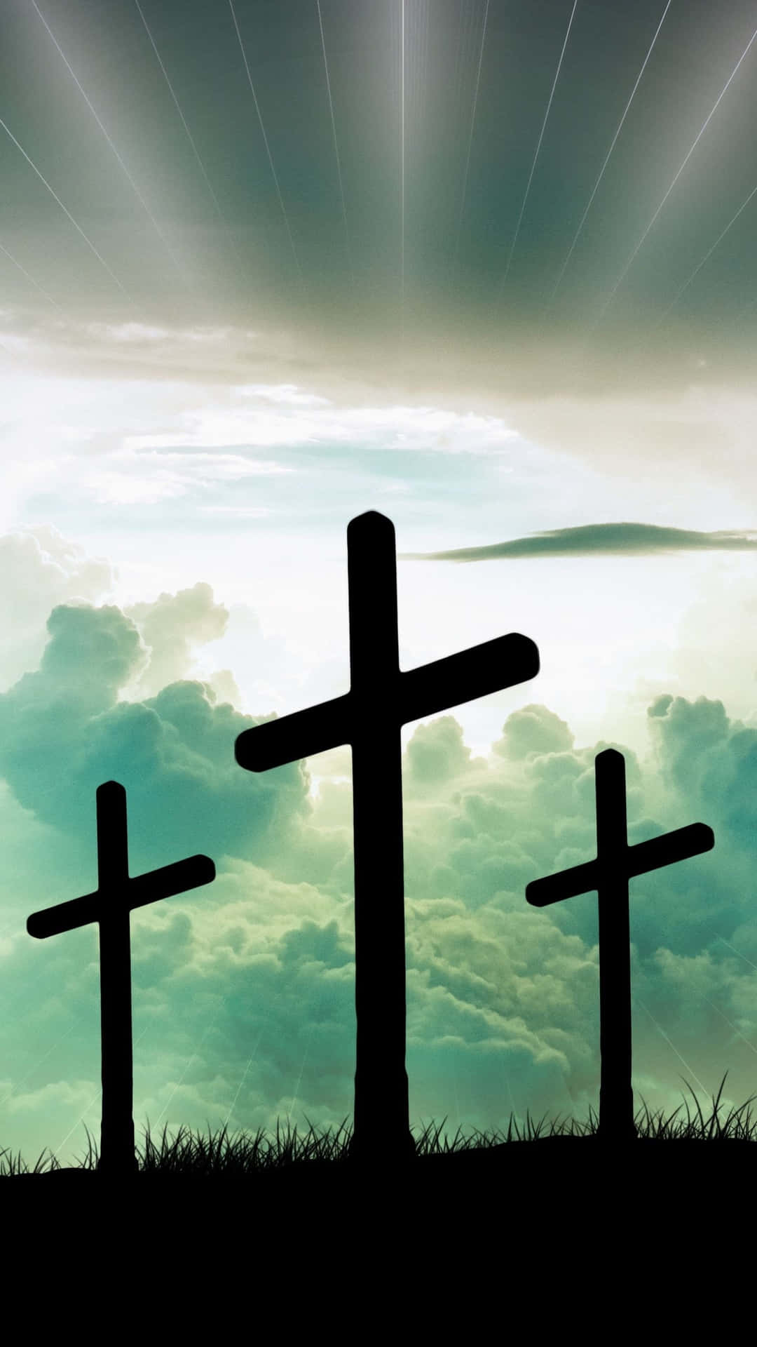Tre kors er silhouetterede mod himlen Wallpaper