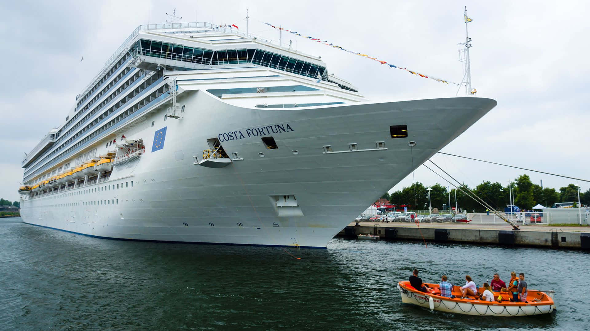 A passenger cruise ship sailing on the blue calm ocean