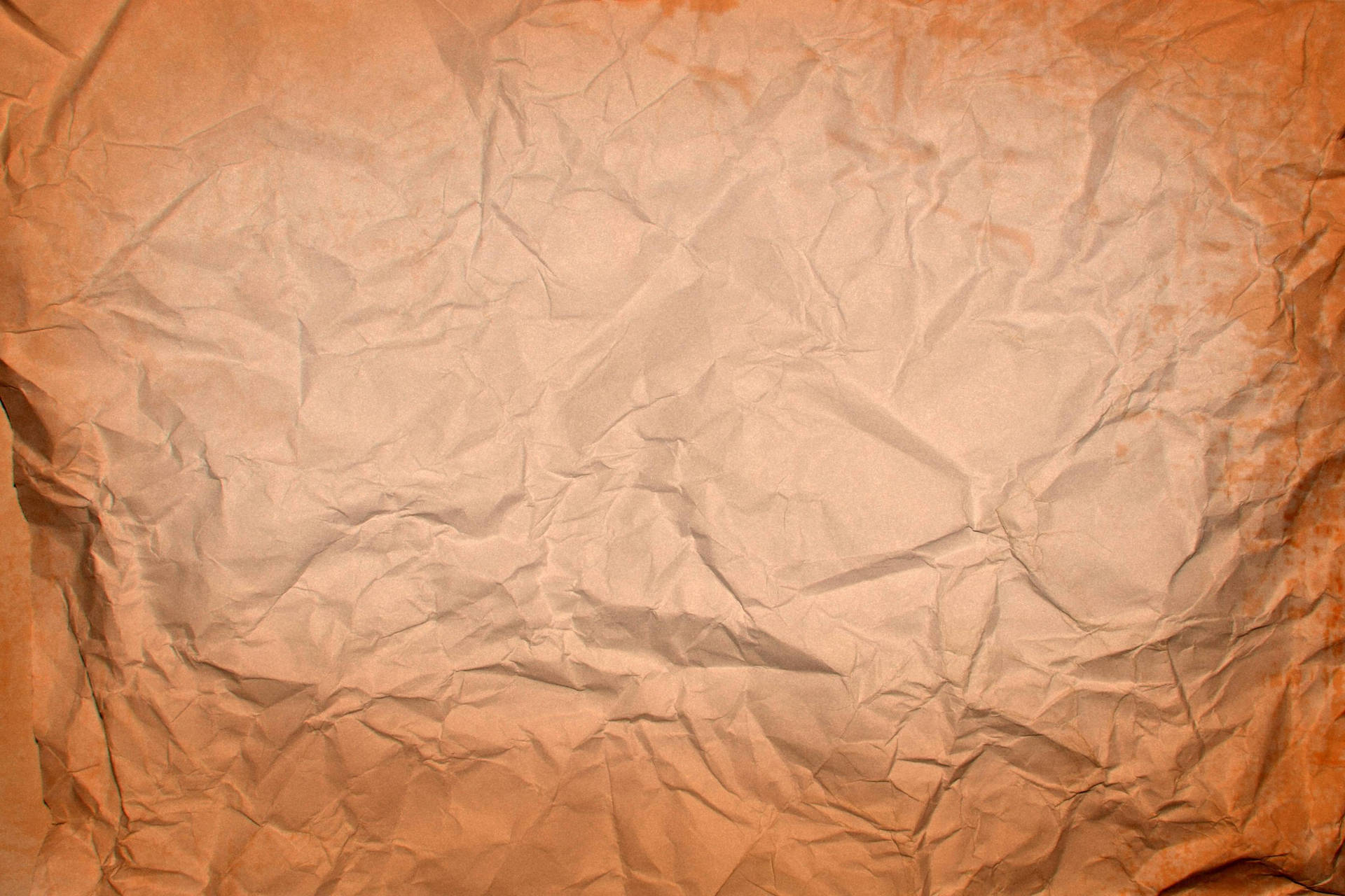 Crumpled Old Paper In Brown Background