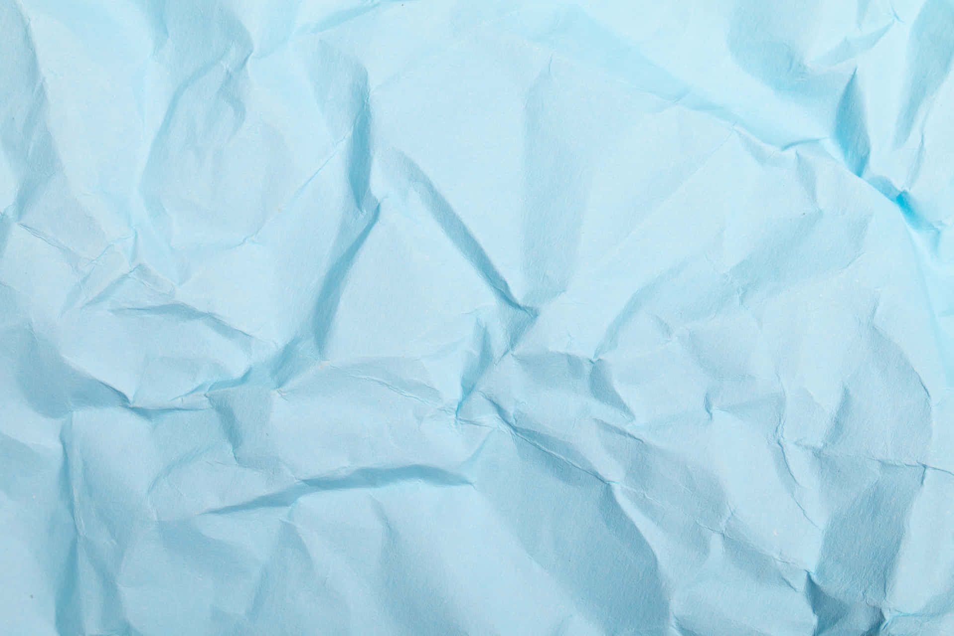 A Blue Paper With Crumpled Edges