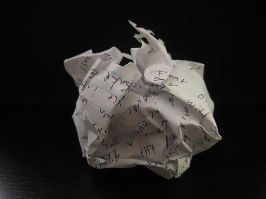 A Ball Of Paper With Writing On It