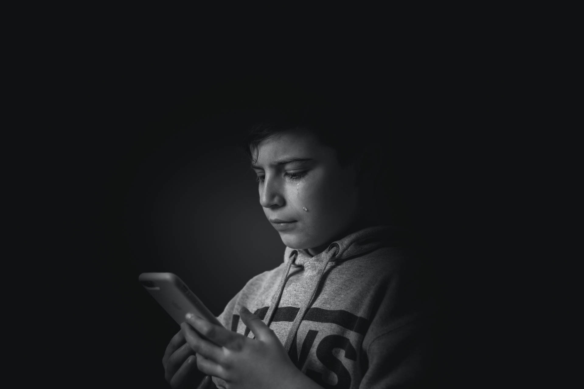 Crying Sad Boy With Smartphone