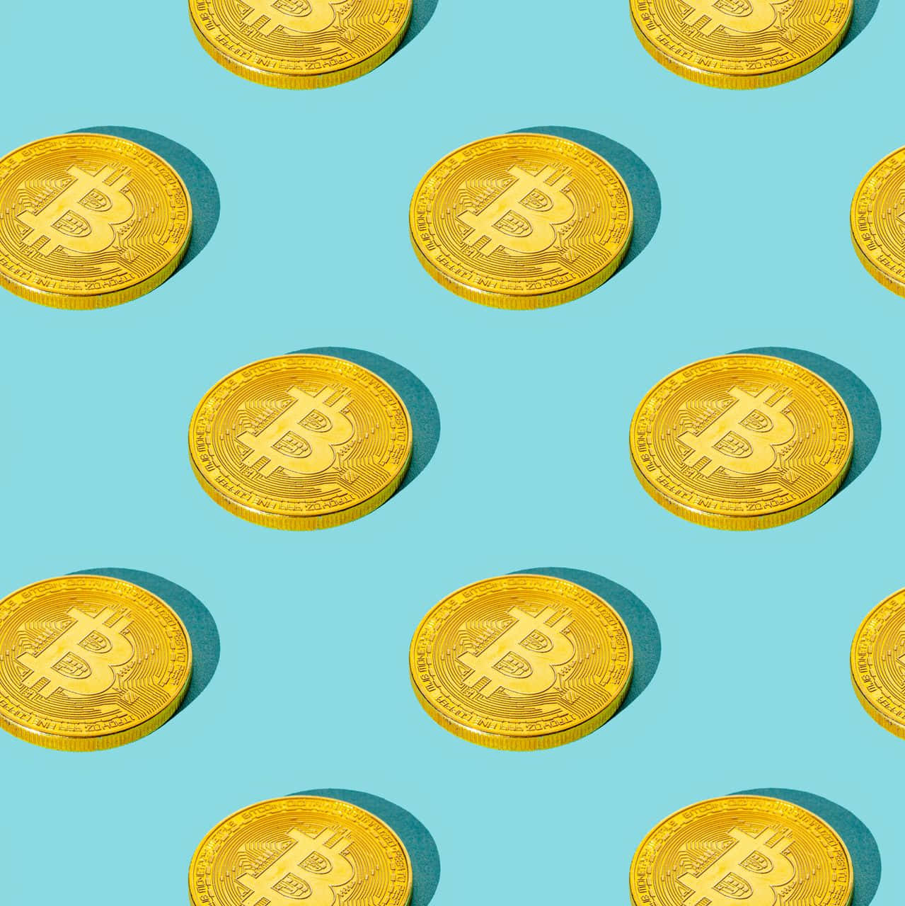 A Pattern Of Gold Bitcoin Coins On A Blue Background