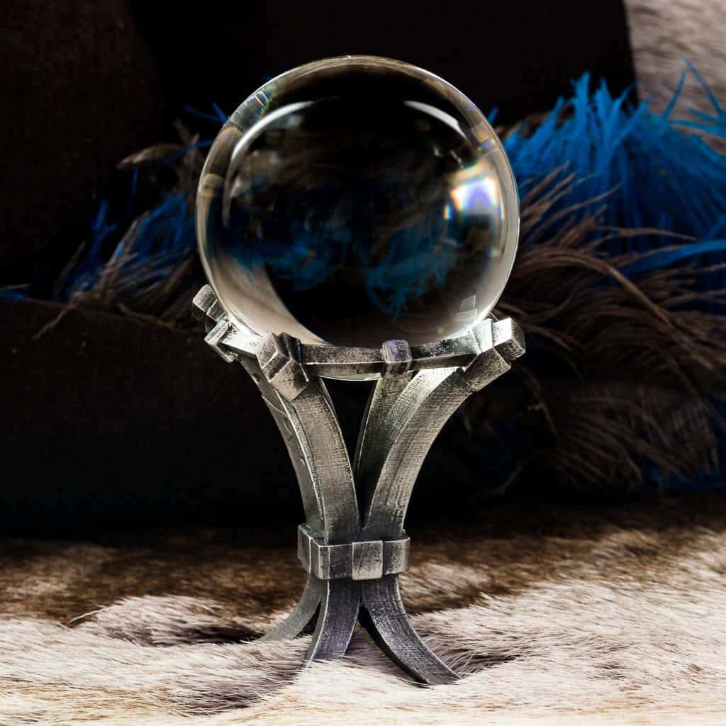 Mystical Crystal Ball on Wooden Table Wallpaper