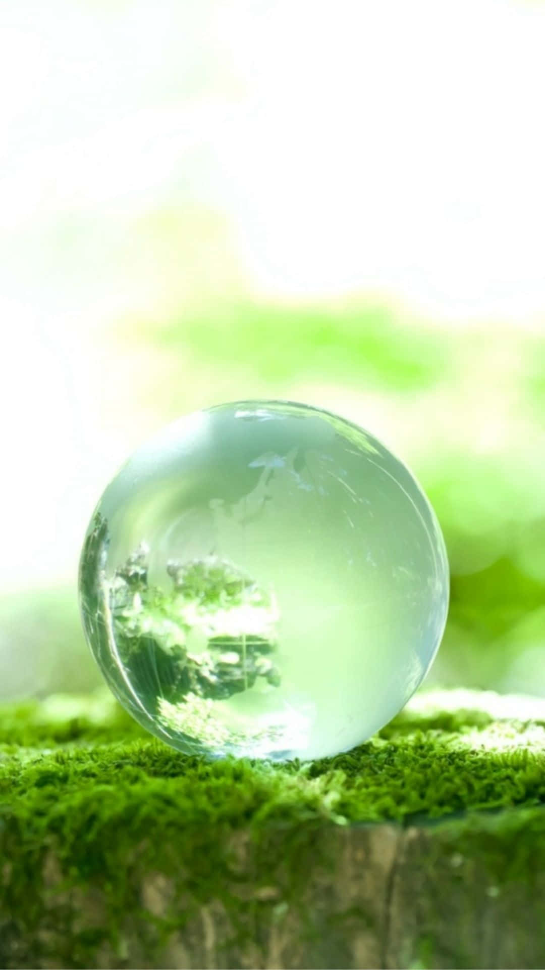 Captivating Crystal Ball on a Multicolored Bokeh Background Wallpaper