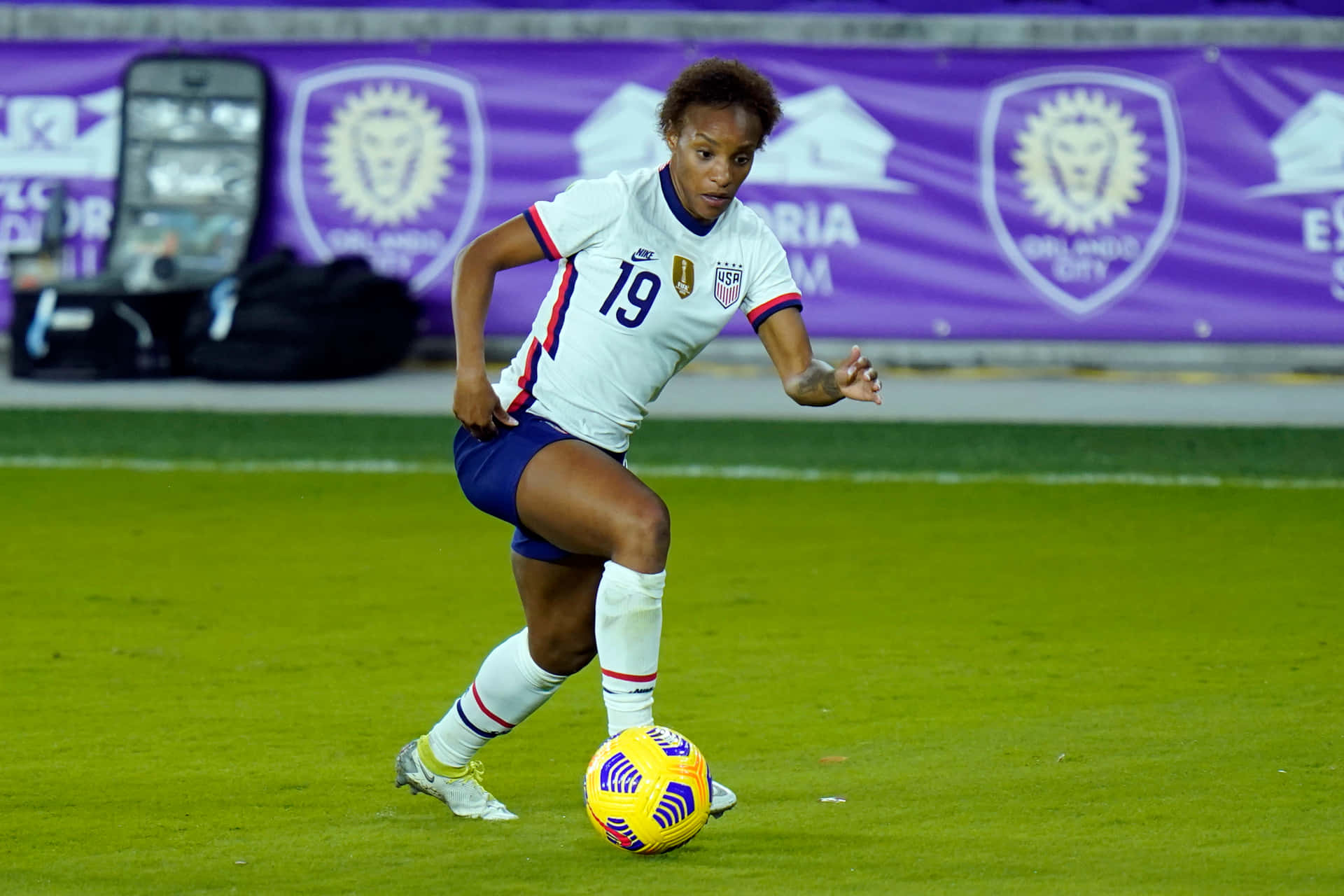 Crystal Dunn In Full Athleticism During A Soccer Match Wallpaper