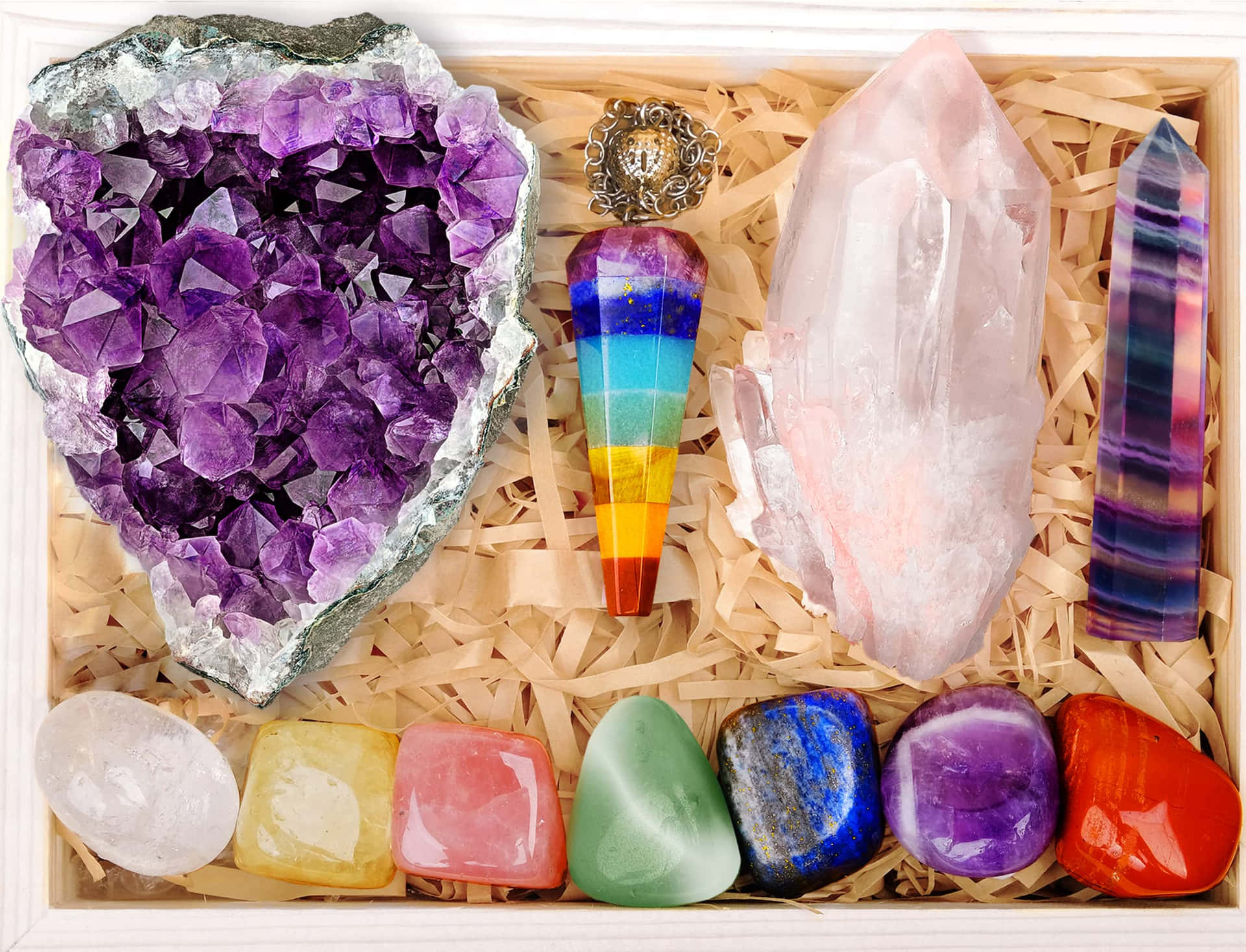 A Box With Various Crystals And Stones In It
