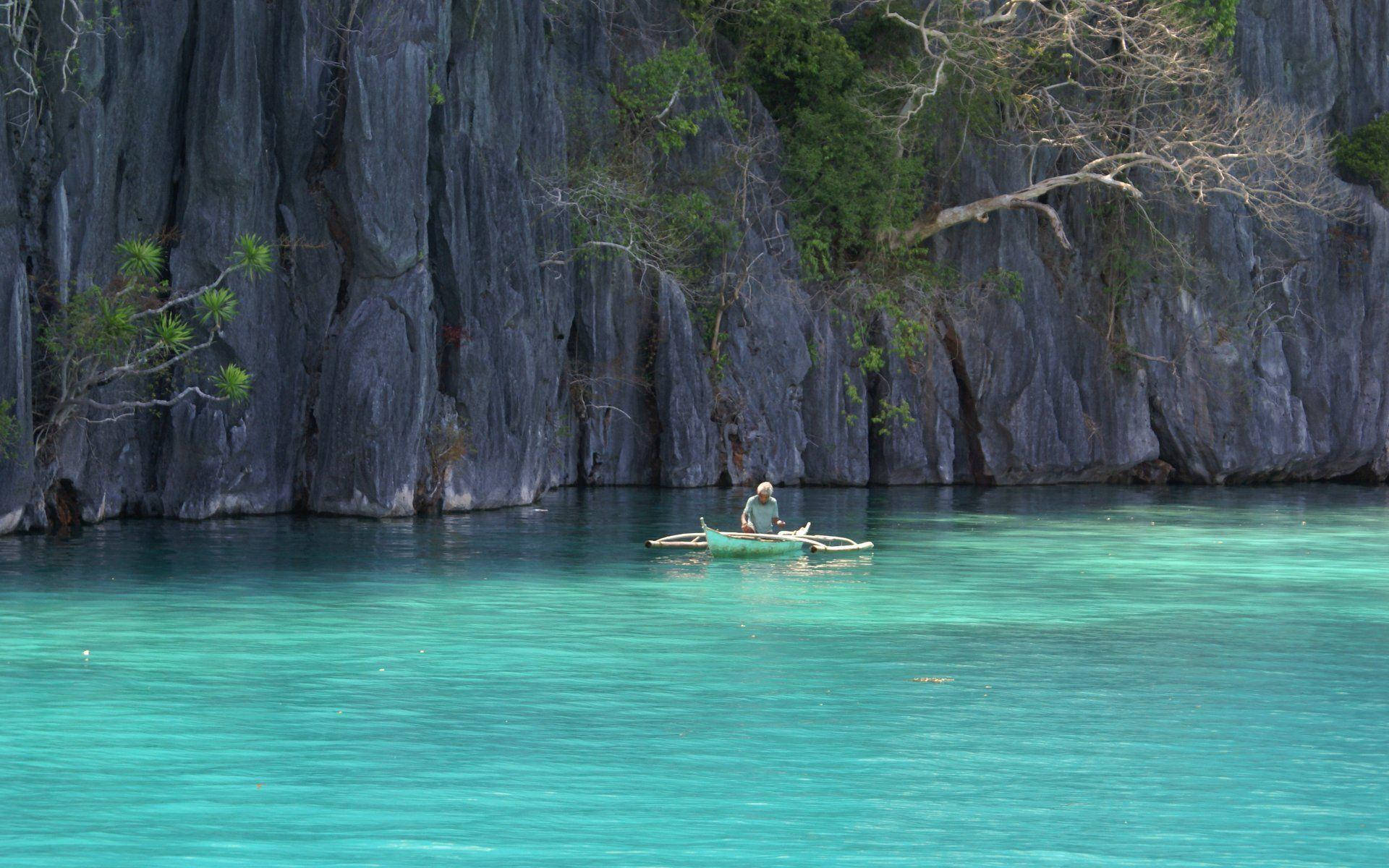 Caption: Stunning views of the crystal clear waters in the Philippines Wallpaper
