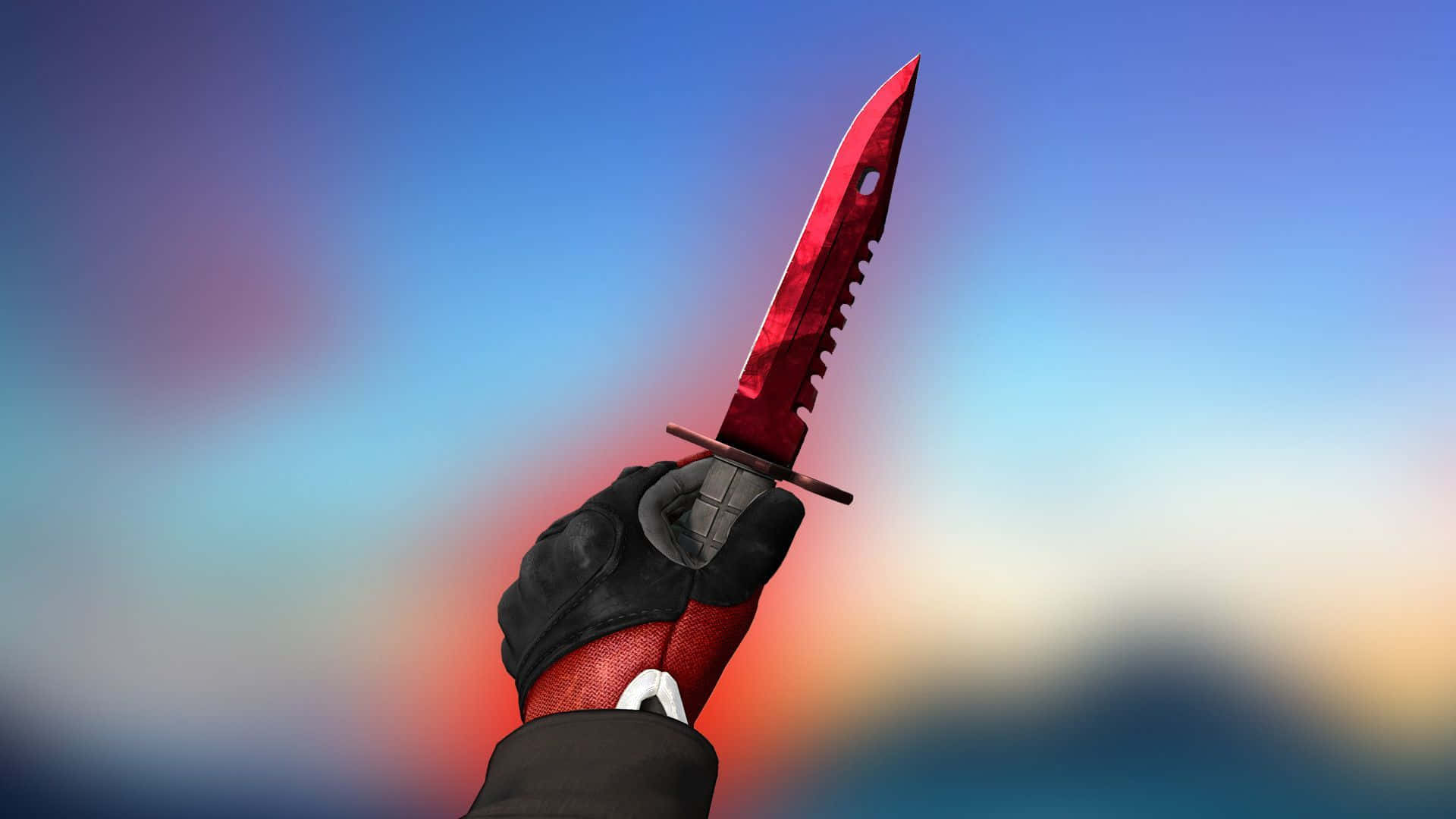 A Red Knife Is Held Up In A Hand