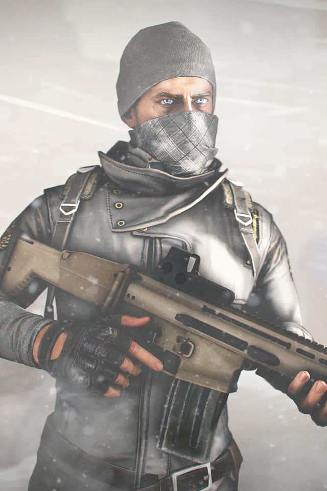 En mand holder et gevær i sneen. Wallpaper