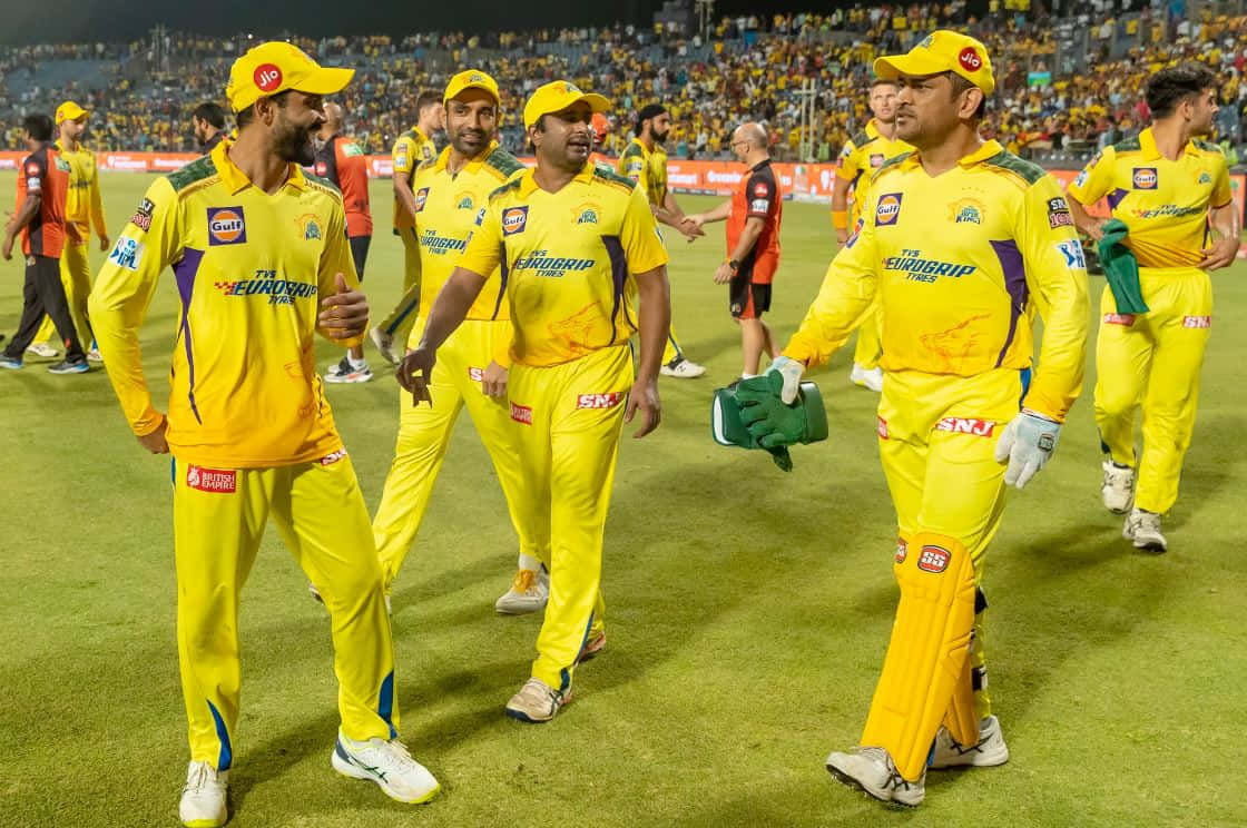 Chennai Super Kings players celebrate their victory on the field