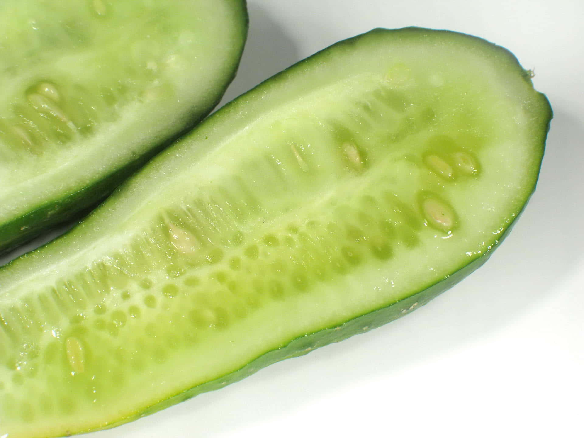 Two Cucumbers Are Cut In Half