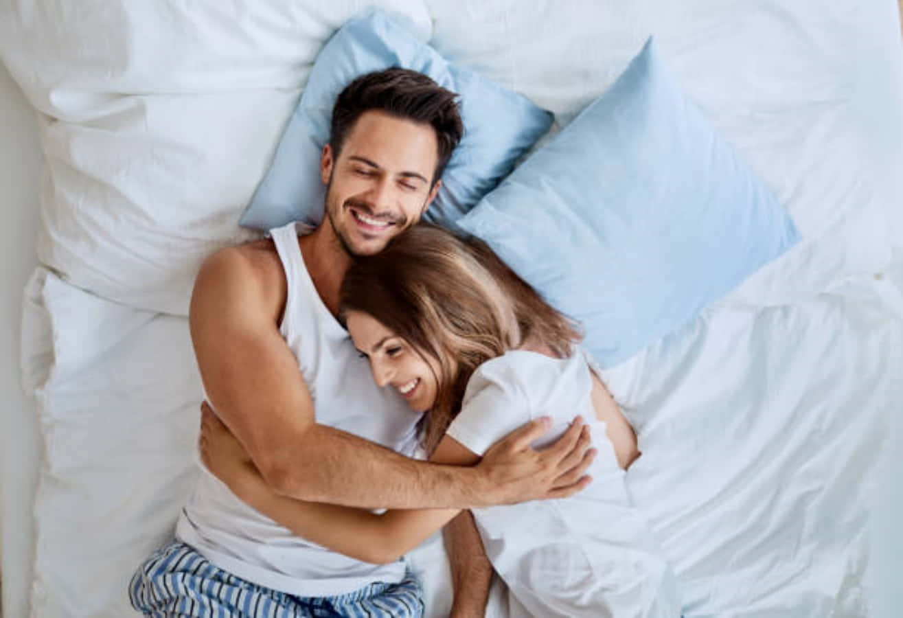 People, bed time concept. Interracial affectionate couple have healthy sleep  in bed, enjoy relaxation, enjoy good rest, pose in bedroom. African  American young man takes nap with Caucasian wife. Stock Photo |