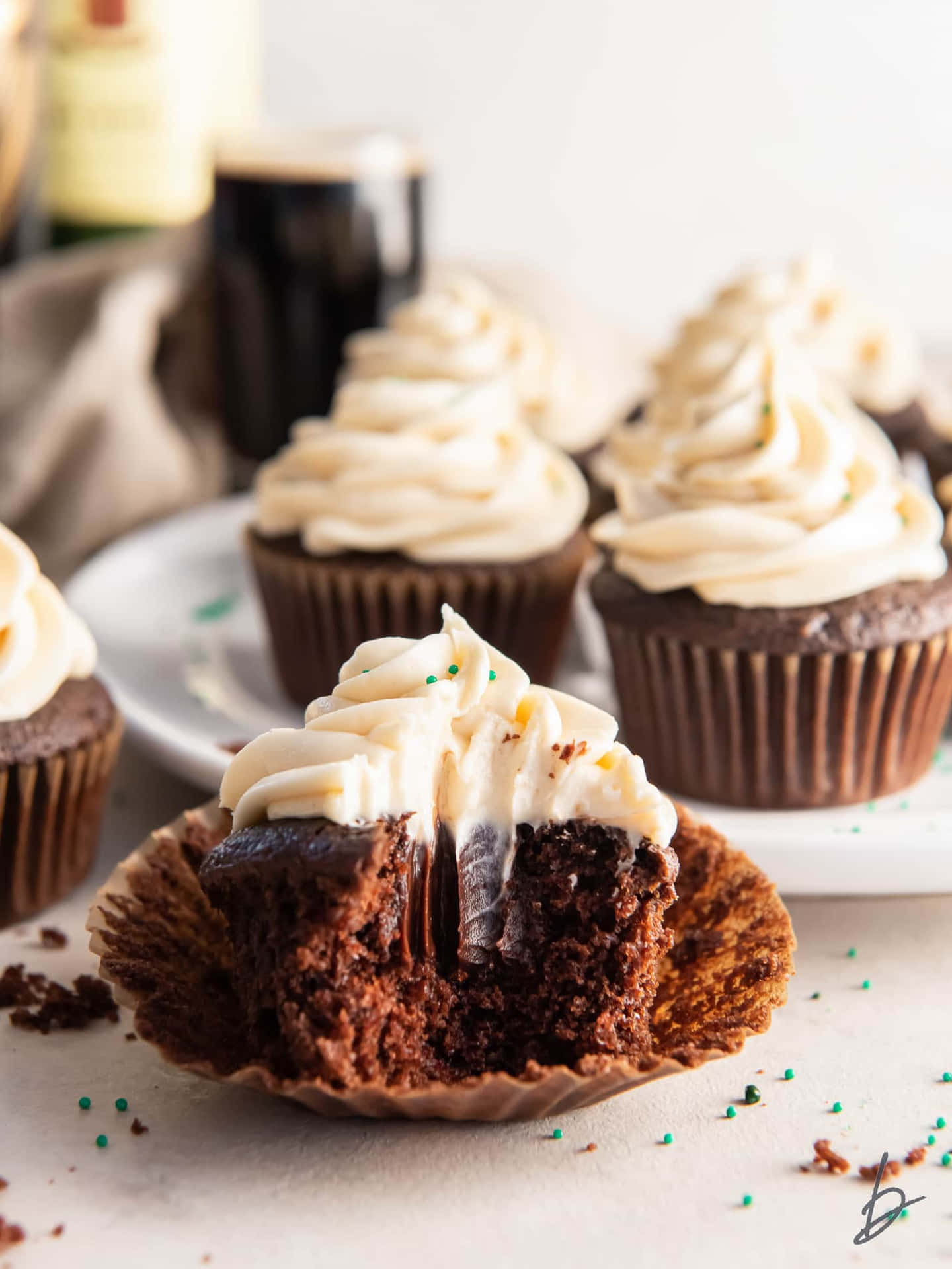Irish Cream Cupcakes With A Bite Taken Out