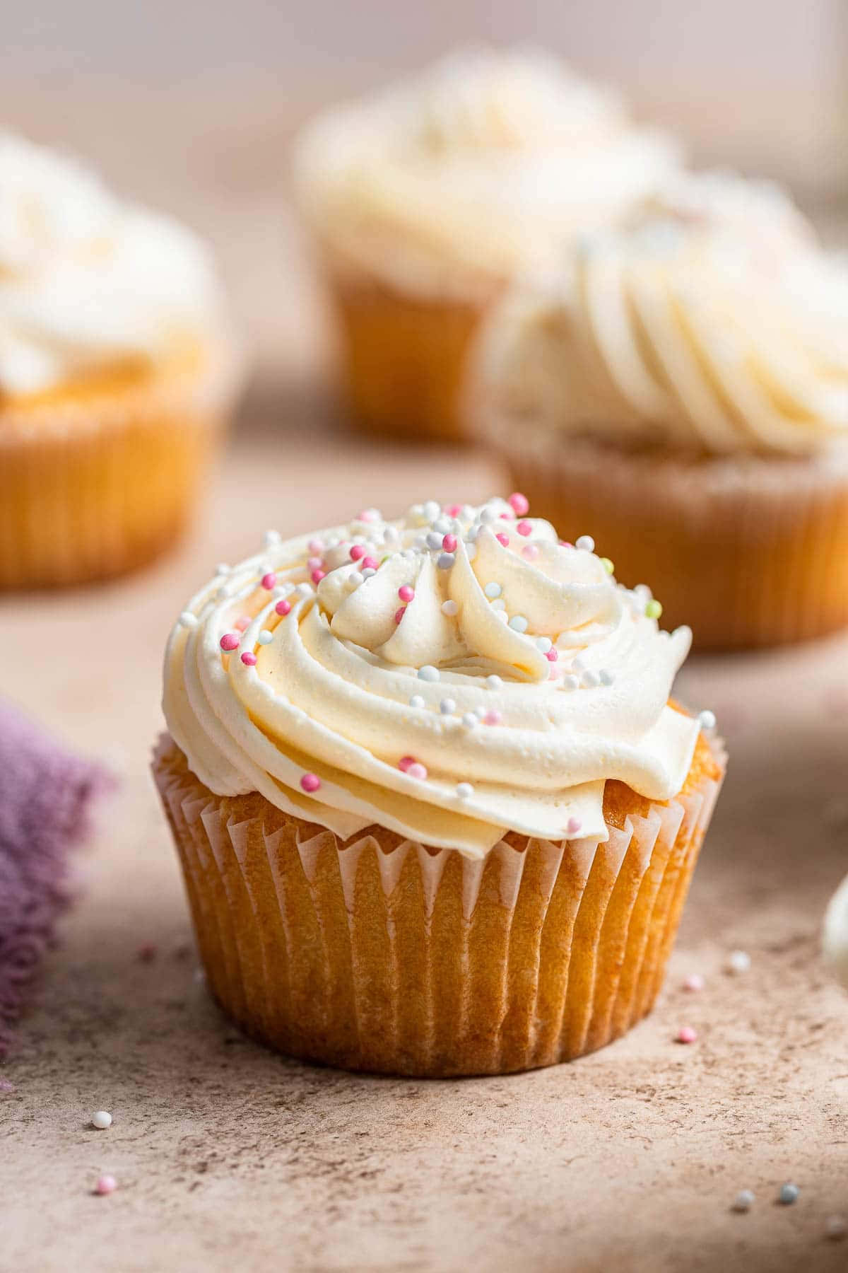 A classic cupcake topped with vibrant sprinkles
