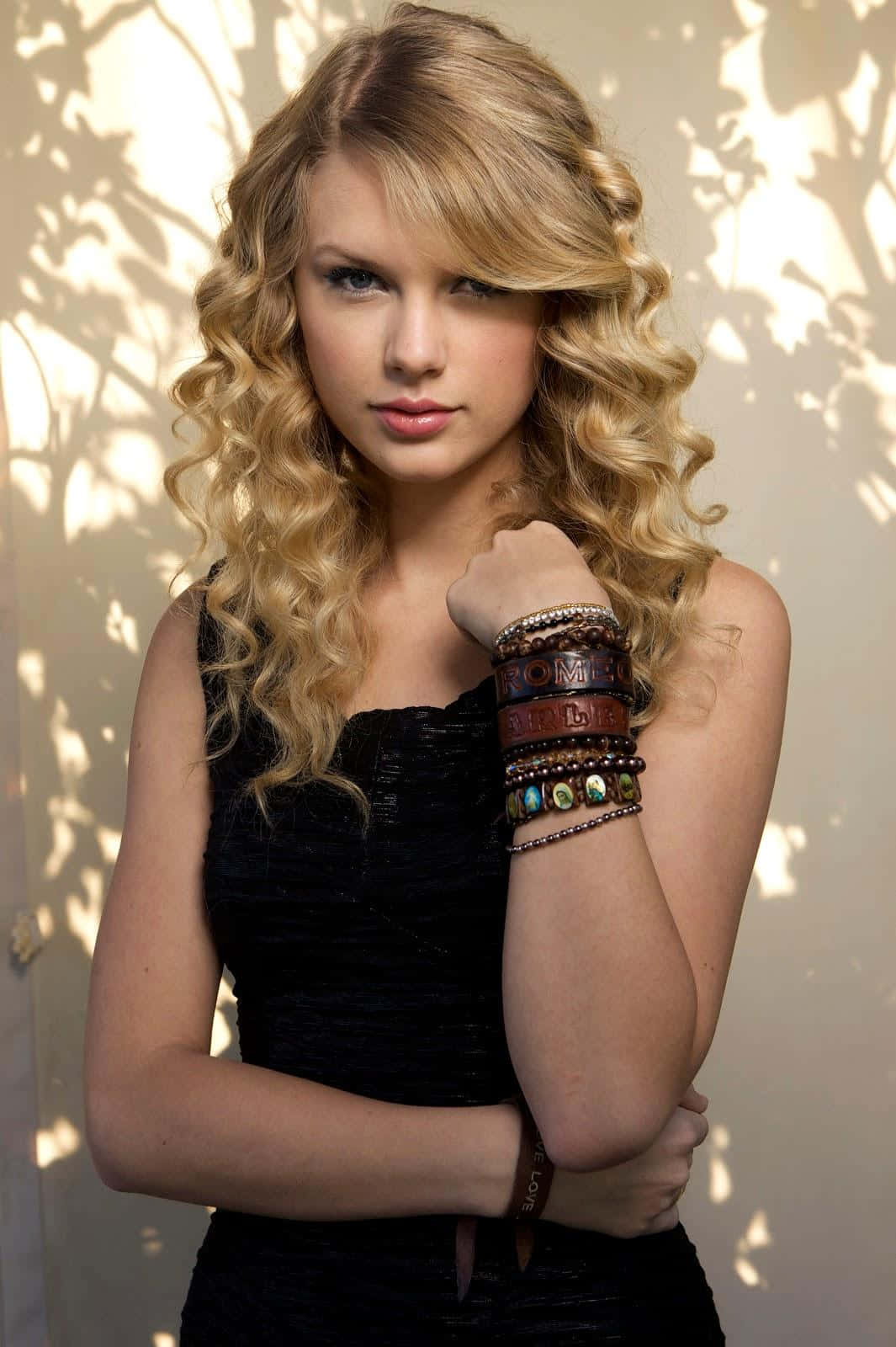 Curly Haired Blondewith Bracelets Wallpaper