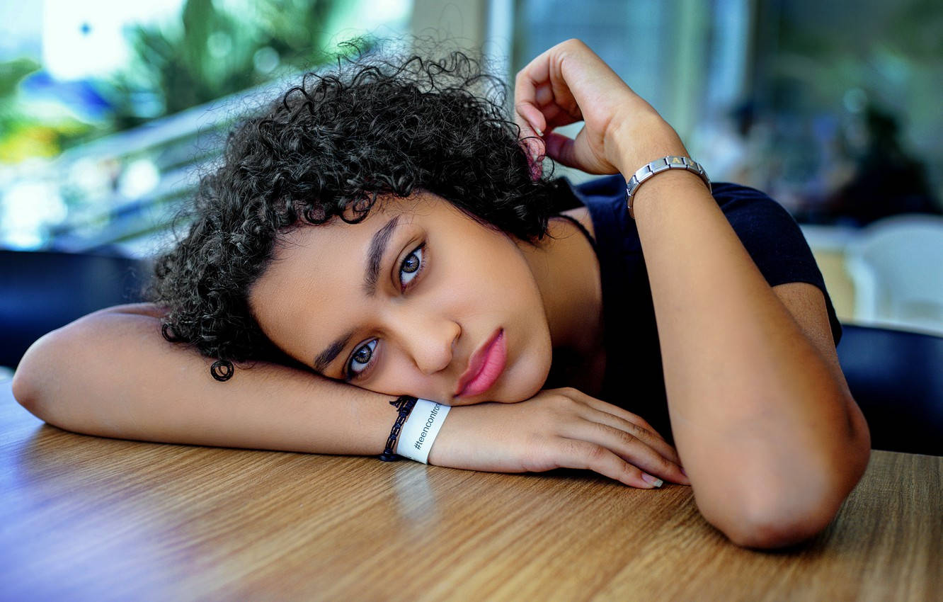 Curly Haired Teenager Sad Eyes Wallpaper