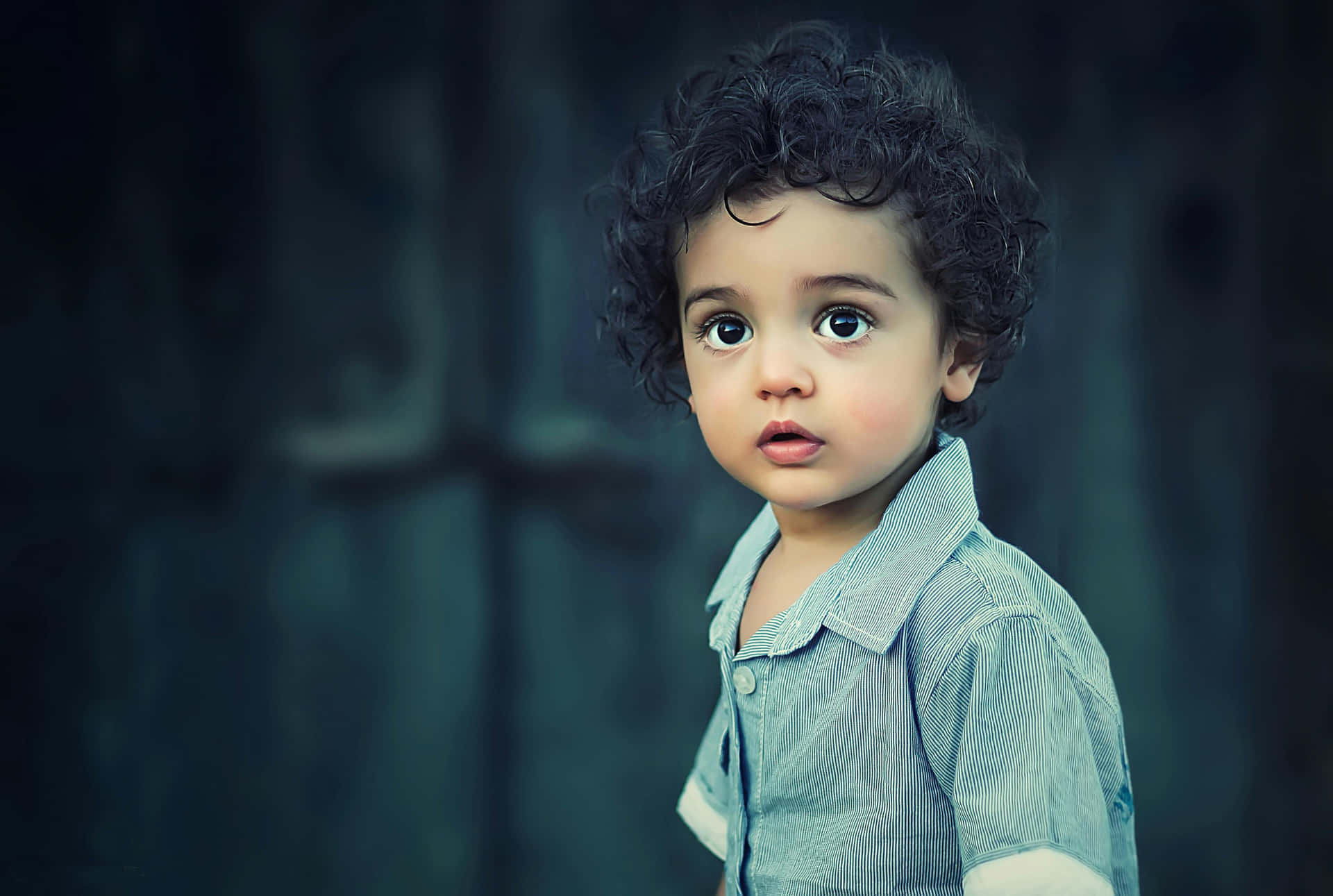 Curly Haired Toddler Portrait Wallpaper