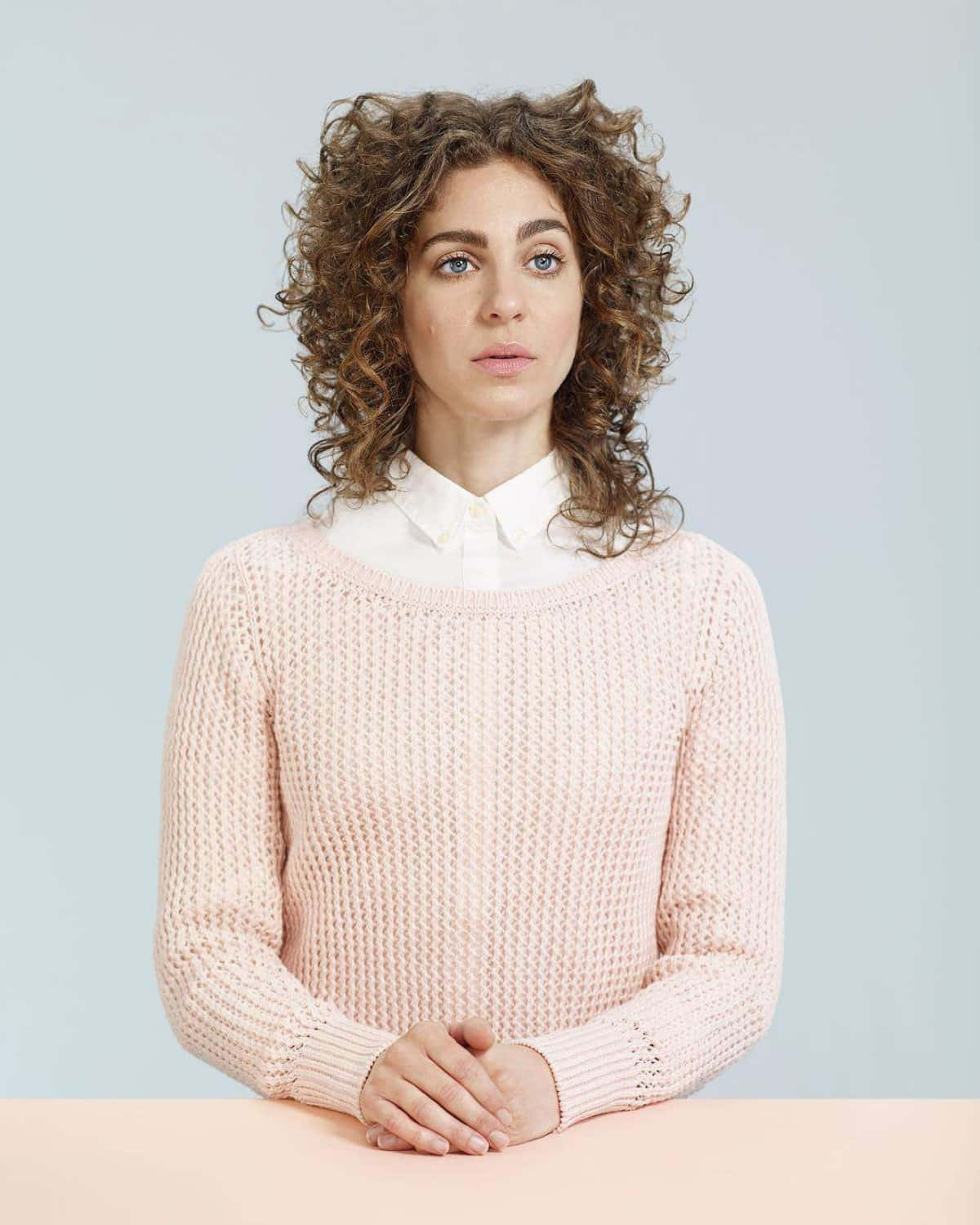 Curly Haired Womanin Pink Sweater Wallpaper