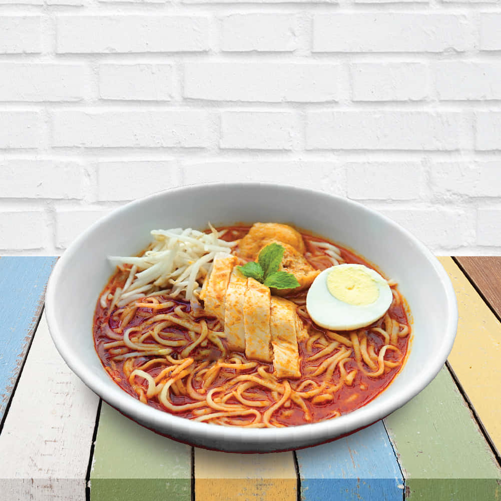Curry Laksa On Colorful Wooden Table Wallpaper