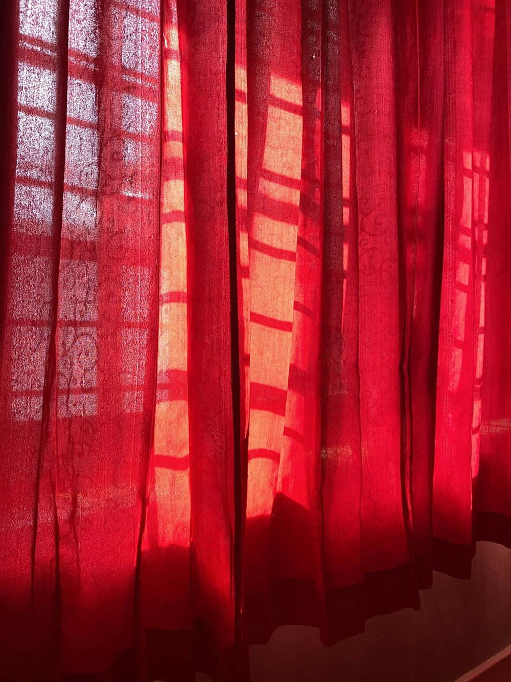 Red Curtains In A Room With Sunlight