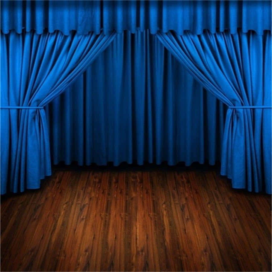 A beautiful blue curtain gently flowing with the wind.
