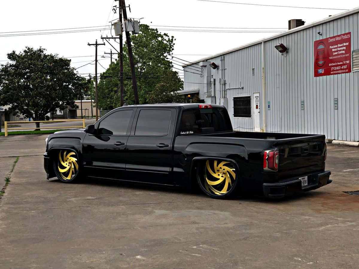 Custom Black Truckwith Yellow Wheels Wallpaper